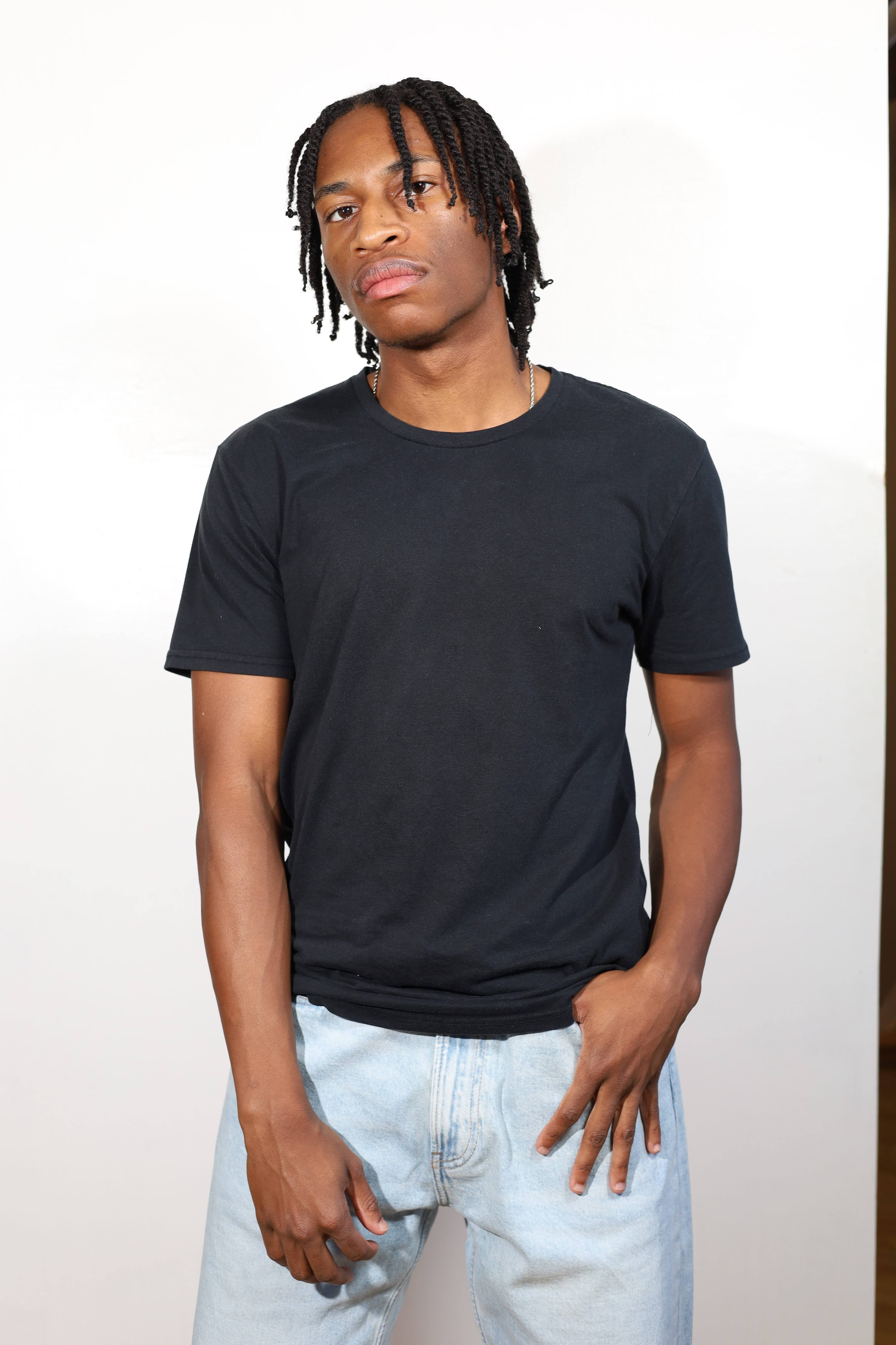 Full body comp — black tee, light jeans